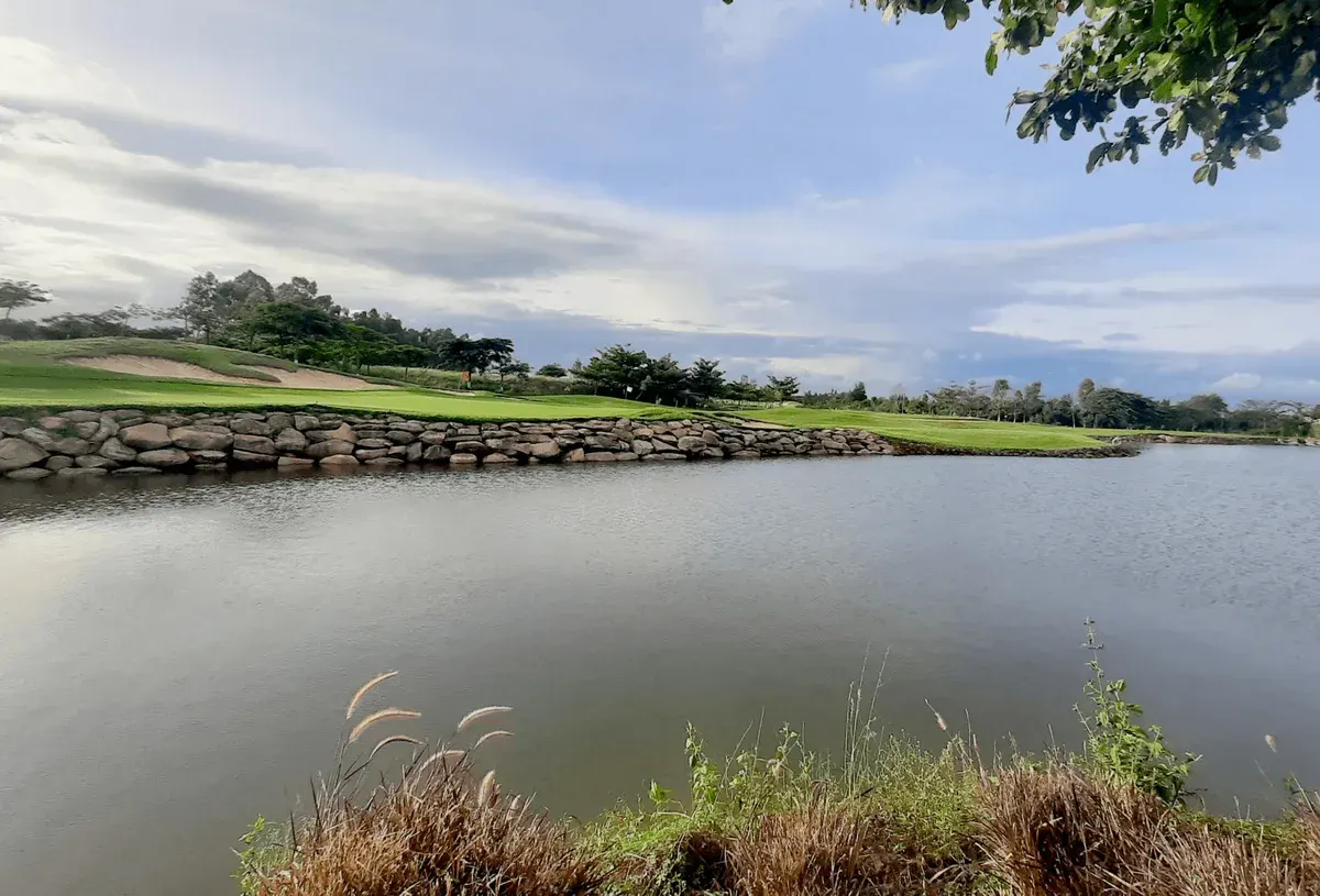 Water and stone-edged greens at Zion Hills golf course